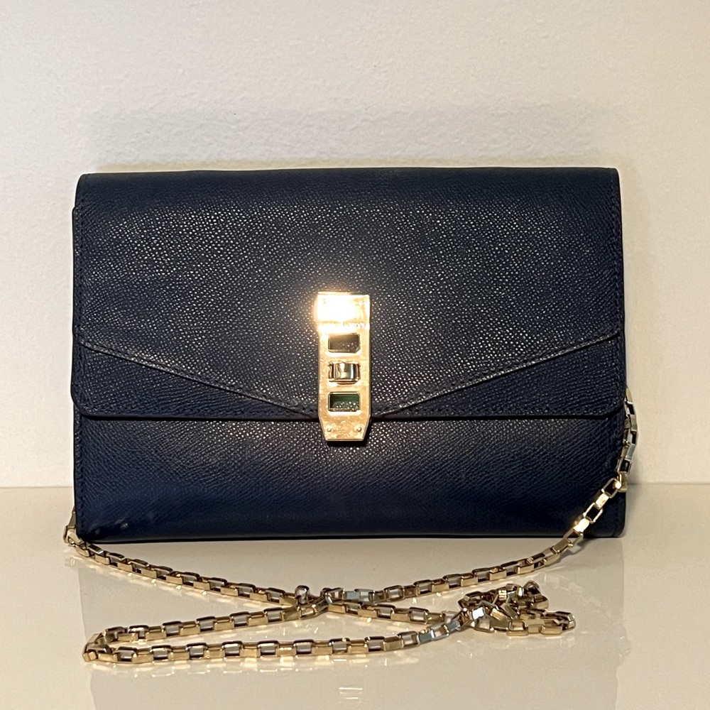 Henri Bendel uptown wallet on a chain. Navy with gold hardware.